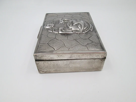 Table desk tobacco case. White alpaca. Articulated lid. Inca idol motif. 1980's