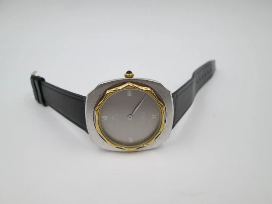 Tell. Satin metal and steel. Gold plated bezel. Manual wind. 1960's. Swiss