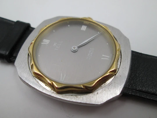 Tell. Satin metal and steel. Gold plated bezel. Manual wind. 1960's. Swiss