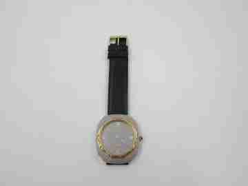 Tell. Satin metal and steel. Gold plated bezel. Manual wind. 1960's. Swiss