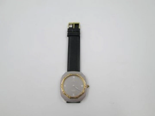 Tell. Satin metal and steel. Gold plated bezel. Manual wind. 1960's. Swiss