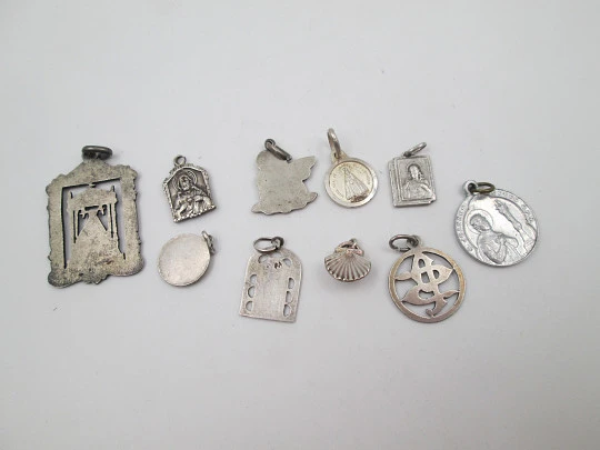 Ten religious medals collection. Sterling silver and aluminum. Spain. 1940-1970's Ten religious medals collection. Sterling silver and aluminum. Spain. 1940-1970's