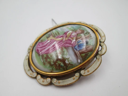 Thomas Lyster Mott brooch. Gold plated metal and painted porcelain. Courtship scene. 1940's