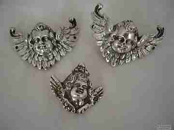 Three ancient apliques. Winged cherubs. Silver. 18-19th centuries