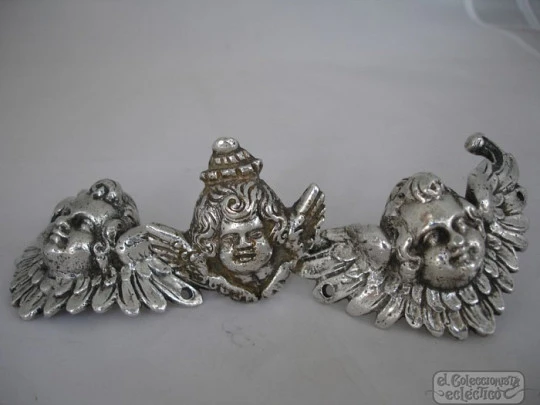 Three ancient apliques. Winged cherubs. Silver. 18-19th centuries