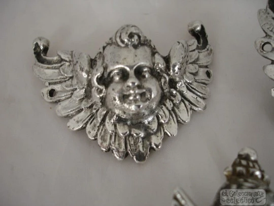 Three ancient apliques. Winged cherubs. Silver. 18-19th centuries