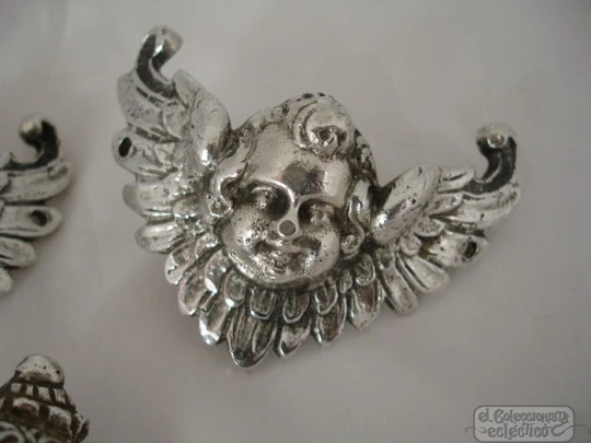 Three ancient apliques. Winged cherubs. Silver. 18-19th centuries