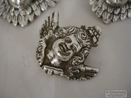 Three ancient apliques. Winged cherubs. Silver. 18-19th centuries