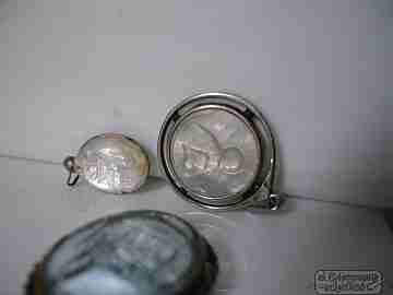 Three medals. Crystal and Pearl. Metal and silver. Virgin and Saints