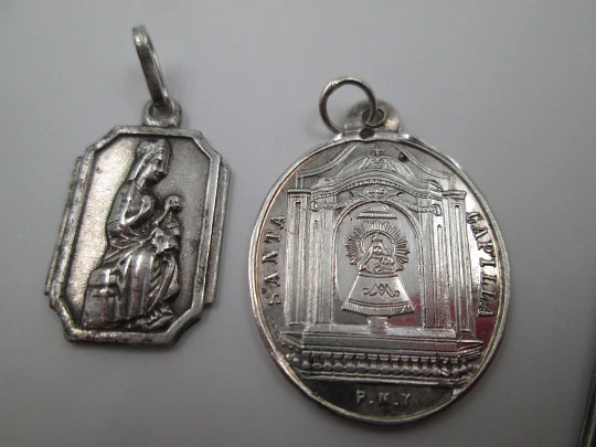 Three medals. Sterling silver. Virgin and Saint Joseph. Relief. 1920's