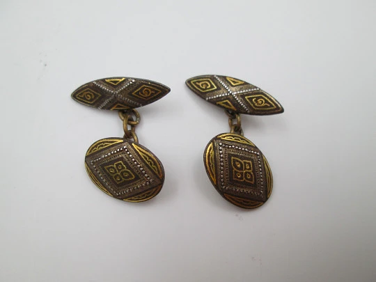 Three men's cufflinks set. Damascene and gold plated. 1970's. Spain