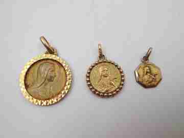 Three religious medals. Gold plated metal. Virgin Mary. Handle and ring. Spain. 1970's