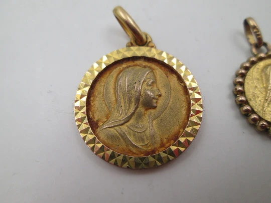 Three religious medals. Gold plated metal. Virgin Mary. Handle and ring. Spain. 1970's