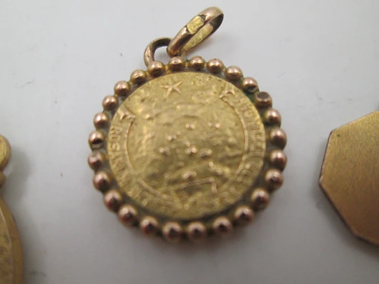 Three religious medals. Gold plated metal. Virgin Mary. Handle and ring. Spain. 1970's