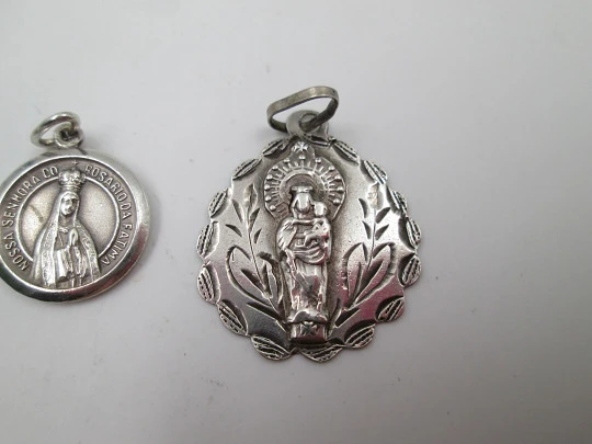 Three religious medals. Sterling silver. Virgin of the Pillar and Lady of the Rosary. 1970's Three religious medals. Sterling silver. Virgin of the Pillar and Lady of the Rosary. 1970's