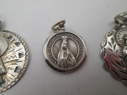 Three religious medals. Sterling silver. Virgin of the Pillar and Lady of the Rosary. 1970's Three religious medals. Sterling silver. Virgin of the Pillar and Lady of the Rosary. 1970's