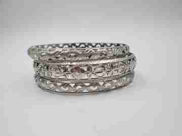 Three women's openwork bangles. Sterling silver. Geometric & floral motifs