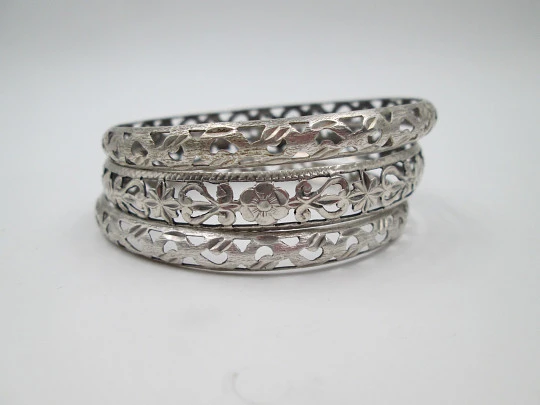 Three women's openwork bangles. Sterling silver. Geometric & floral motifs