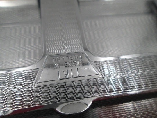 Tiki cigarette case with petrol lighter. Silver plated metal. Waves motifs. England. 1960's