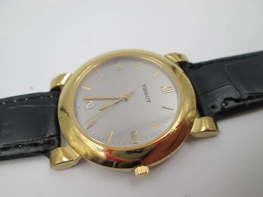 Tissot. Gold plated & stainless steel. Quartz. Leather strap. Date. 1980's