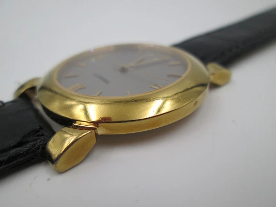 Tissot. Gold plated & stainless steel. Quartz. Leather strap. Date. 1980's