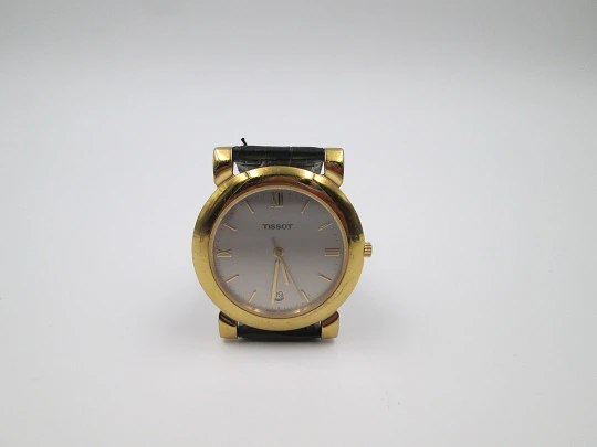 Tissot. Gold plated & stainless steel. Quartz. Leather strap. Date. 1980's