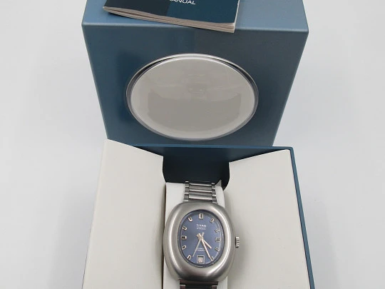 Titan. Acero inoxidable. Automático. Brazalete. Dial azul. Calendario. Estuche. 1970. Suiza