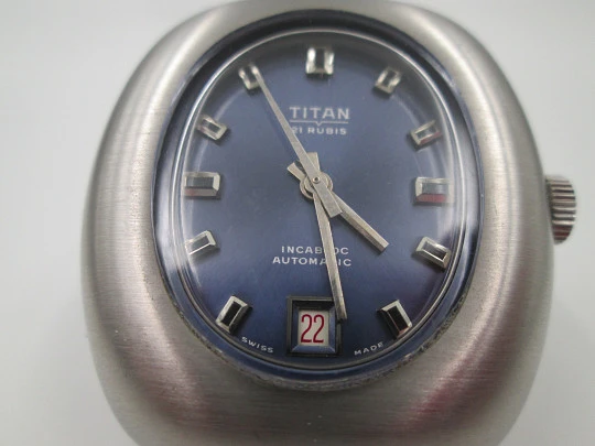 Titan. Acero inoxidable. Automático. Brazalete. Dial azul. Calendario. Estuche. 1970. Suiza