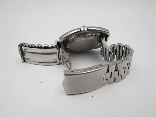 Titan. Acero inoxidable. Automático. Brazalete. Esfera gris. Calendario. 1970. Suiza