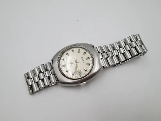 Titan. Acero inoxidable. Automático. Brazalete. Esfera gris. Calendario. 1970. Suiza