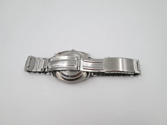Titan. Stainless steel. Automatic. Bracelet. Iridescent dial. Calendar. 1970's. Swiss