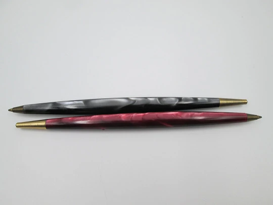 Two ballpoint pens. Red and grey pearl marble resin. Gold plated details. 1950's