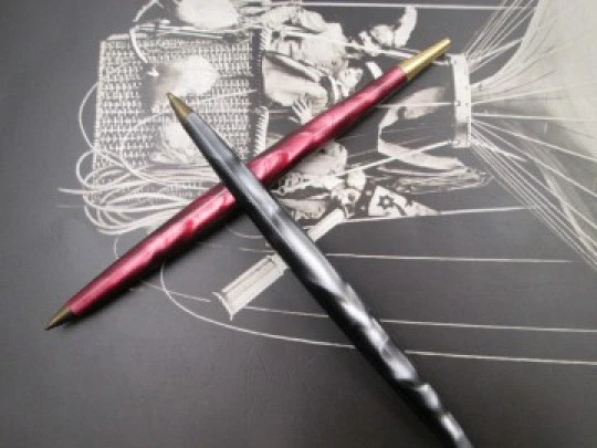 Two ballpoint pens. Red and grey pearl marble resin. Gold plated details. 1950's