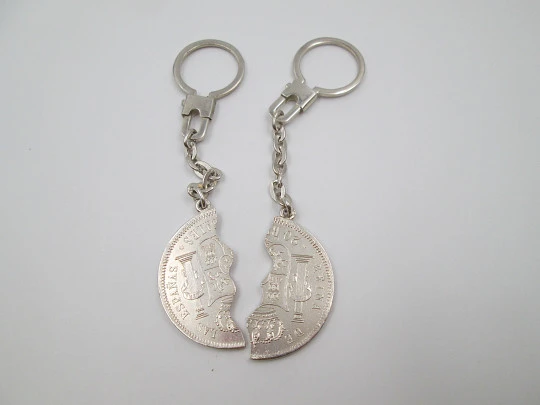 Two keychains. 900 sterling silver. Queen Isabel II. Divided 20 real coin