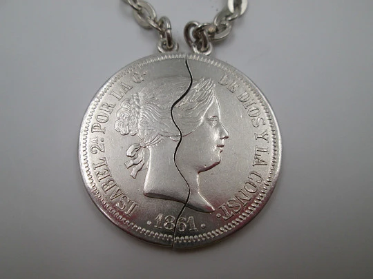 Two keychains. 900 sterling silver. Queen Isabel II. Divided 20 real coin