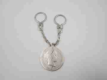Two keychains. 900 sterling silver. Queen Isabel II. Divided 20 real coin