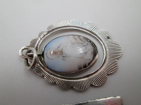 Two openwork religious medals. Sterling silver. Virgin Mary. Ring on top. Spain. 1950's