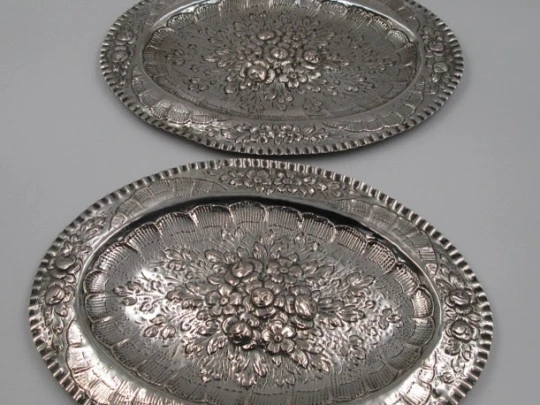 Two sterling silver embossed trays. Floral motifs. Spain. Circa 1900