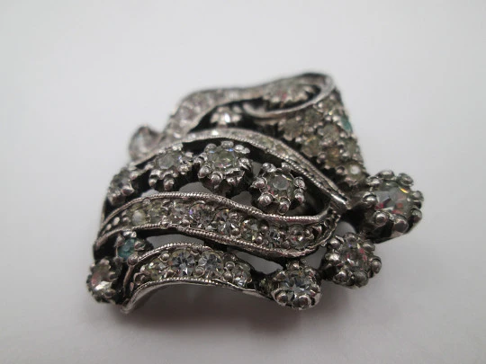 Two women's dress brooches / clips. Silver-plated metal and rhinestones. France. 1910's