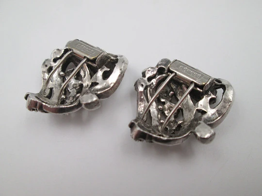 Two women's dress brooches / clips. Silver-plated metal and rhinestones. France. 1910's