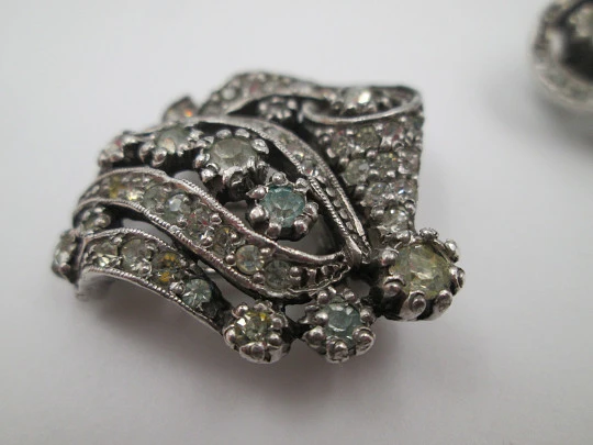 Two women's dress brooches / clips. Silver-plated metal and rhinestones. France. 1910's