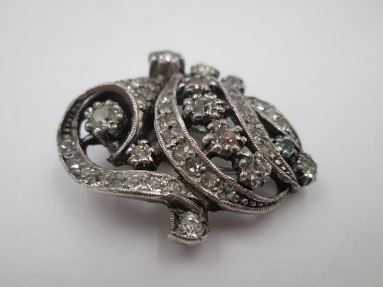 Two women's dress brooches / clips. Silver-plated metal and rhinestones. France. 1910's