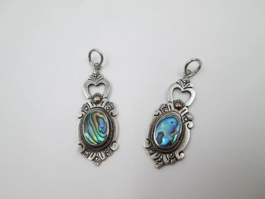 Two women's pendants. Sterling silver and mother-of-pearl. Floral motifs. 1980's