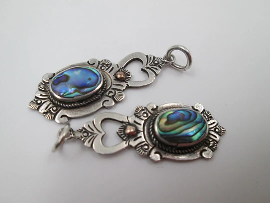 Two women's pendants. Sterling silver and mother-of-pearl. Floral motifs. 1980's