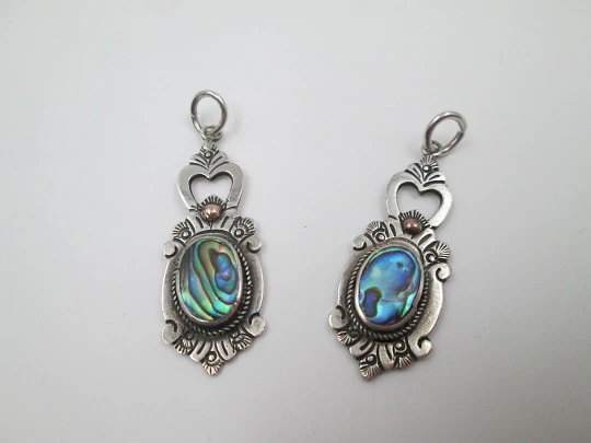 Two women's pendants. Sterling silver and mother-of-pearl. Floral motifs. 1980's