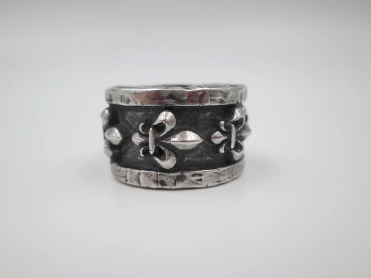 Unisex broad ring. Sterling silver. Fleur-de-lis relief ornaments. Europe. 1990's