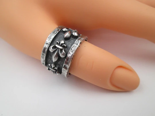 Unisex broad ring. Sterling silver. Fleur-de-lis relief ornaments. Europe. 1990's
