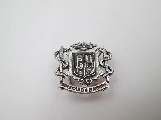 Unisex lapel emblem. Sterling silver. Zamora city shield and pharmacy caduceus. 1980's