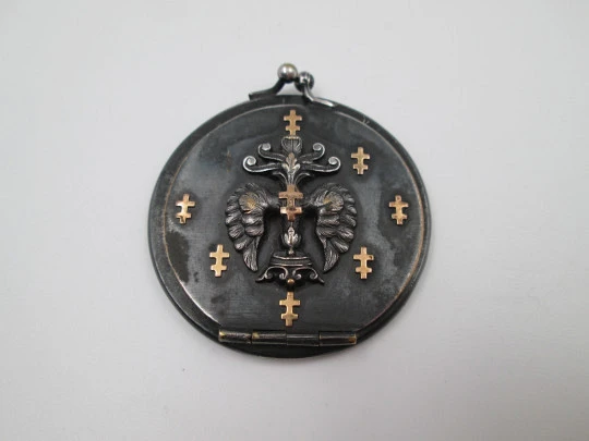 Unisex pocket photo frame. Blackened steel and gold trims. Heraldic symbols. Europe