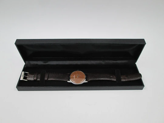 Universal Geneve rare dress watch. Ultra thin steel case and wooden dial. Manual wind